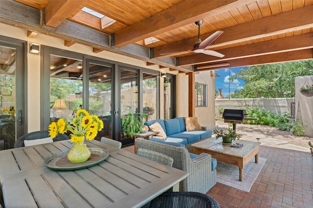 view of patio featuring a grill, outdoor lounge area, and ceiling fan