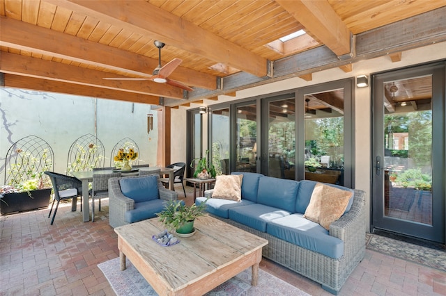 view of patio with outdoor lounge area and ceiling fan