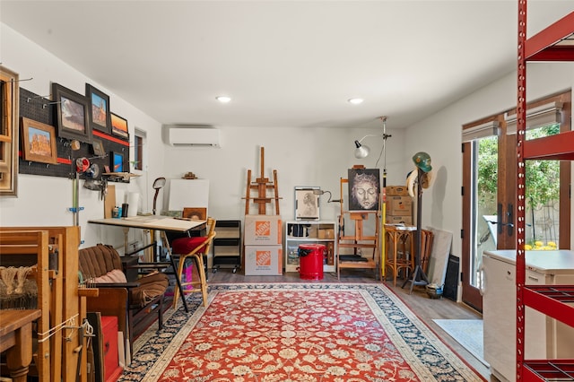 interior space with hardwood / wood-style flooring and an AC wall unit