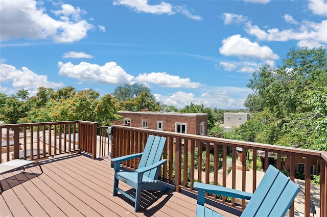 wooden deck featuring an outbuilding