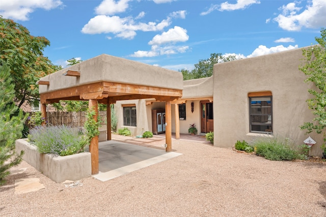 rear view of house featuring a patio