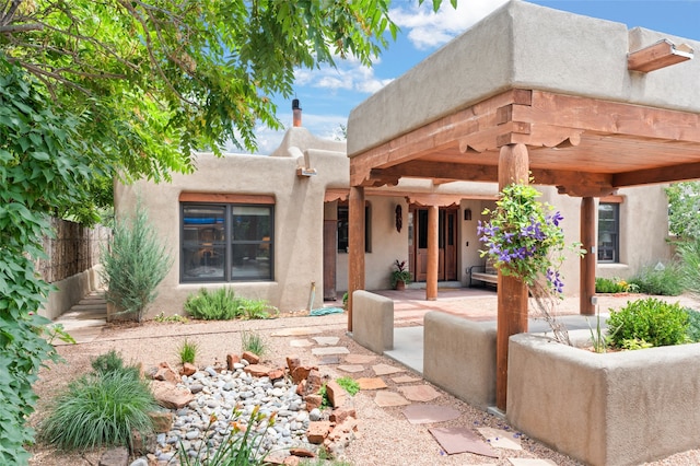 rear view of house featuring a patio