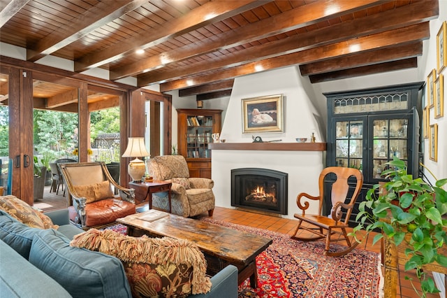 living room with beamed ceiling, wood ceiling, a fireplace, and french doors