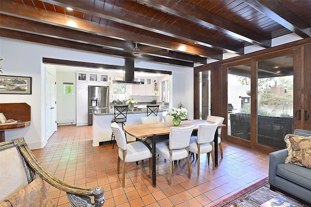 tiled dining area with beamed ceiling and wood ceiling