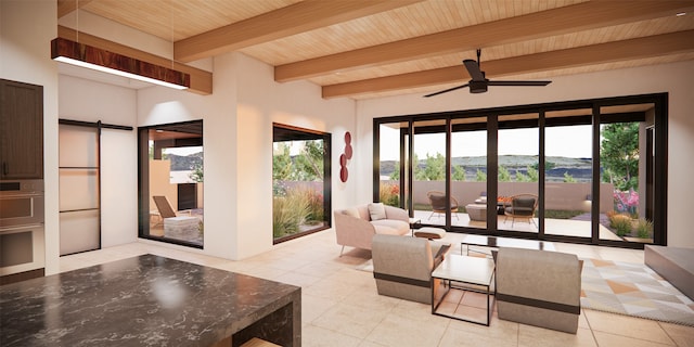 interior space featuring light tile patterned flooring, beamed ceiling, wooden ceiling, and ceiling fan