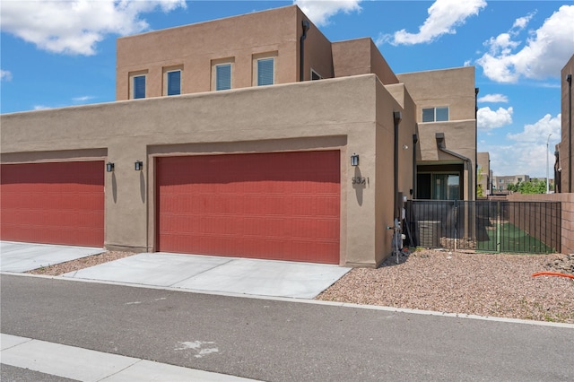 adobe home featuring a garage