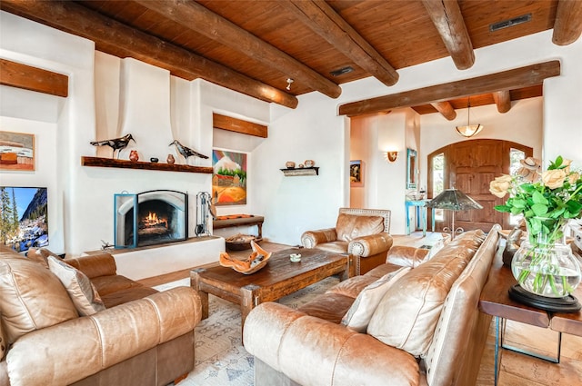 living room with beamed ceiling and wood ceiling