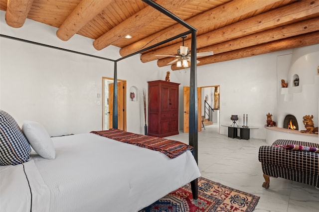 bedroom featuring beam ceiling, ceiling fan, and wood ceiling