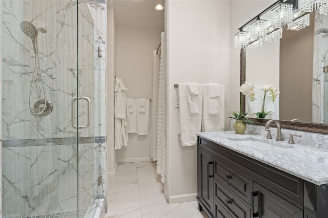 bathroom with walk in shower, a chandelier, and vanity