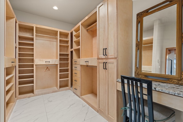 spacious closet with built in desk