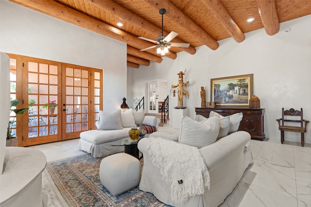 living room with wooden ceiling, beam ceiling, french doors, and ceiling fan