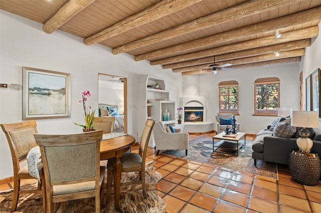 dining room with wood ceiling, tile patterned flooring, and beam ceiling