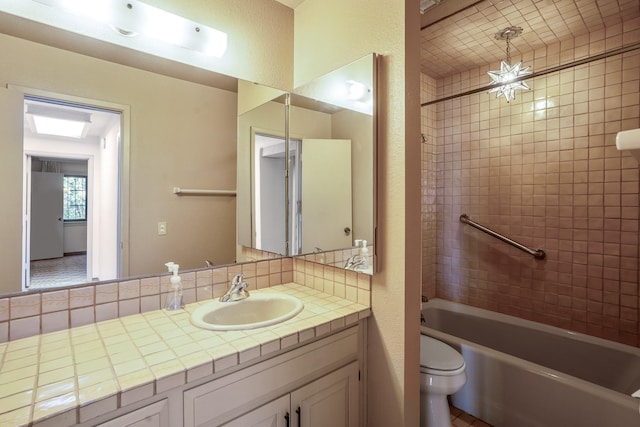 full bathroom featuring a textured wall, backsplash, toilet, vanity, and shower / tub combination