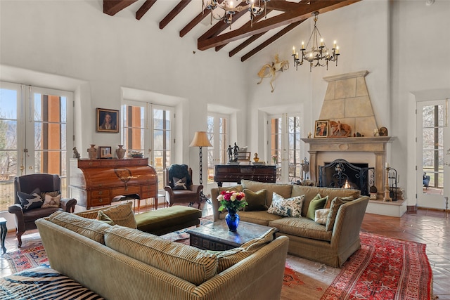 living room featuring beam ceiling, high vaulted ceiling, french doors, and plenty of natural light