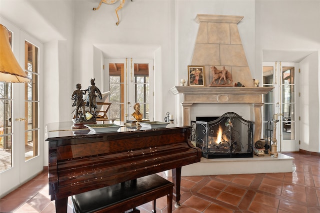 miscellaneous room with tile patterned floors, french doors, and plenty of natural light