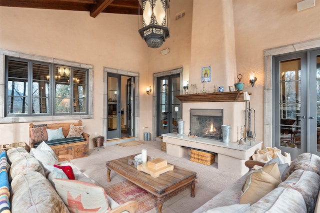 living room featuring beam ceiling, french doors, high vaulted ceiling, and wood ceiling