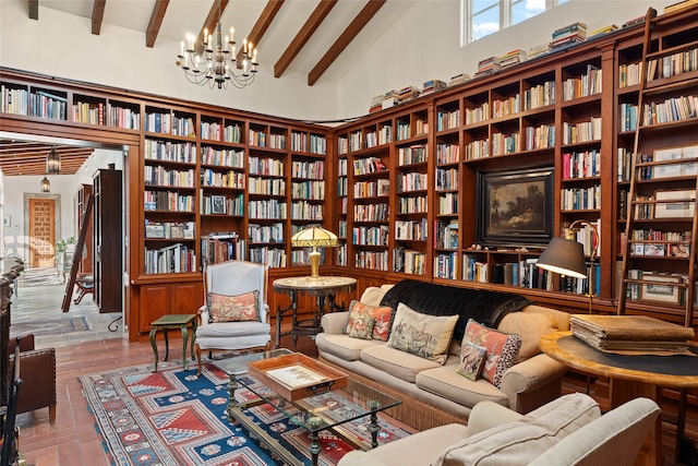 sitting room featuring an inviting chandelier, beamed ceiling, and high vaulted ceiling