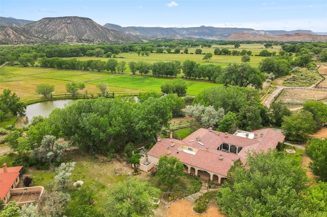 aerial view featuring a rural view and a water and mountain view