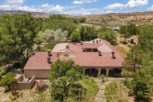 birds eye view of property with a mountain view