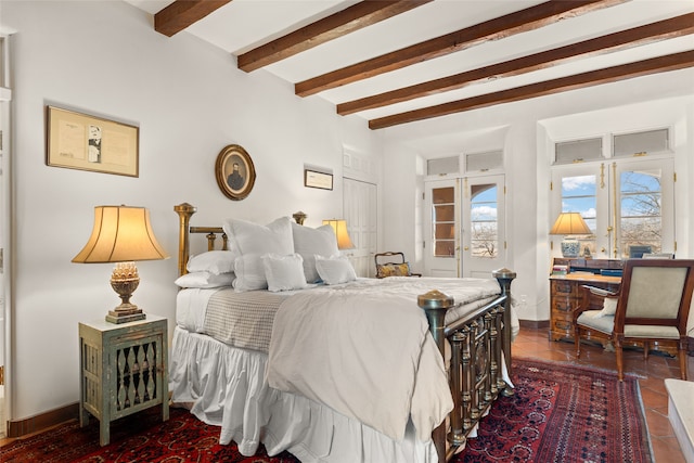 tiled bedroom featuring beam ceiling