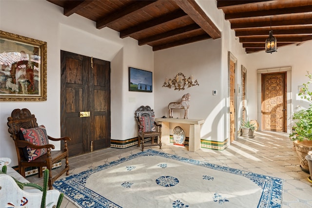 interior space with beam ceiling and wood ceiling