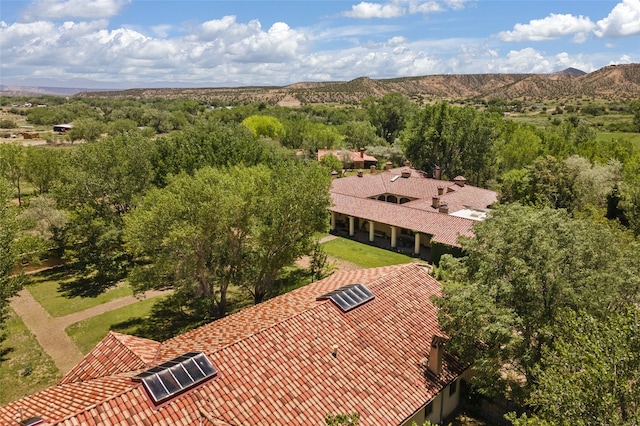 drone / aerial view featuring a mountain view