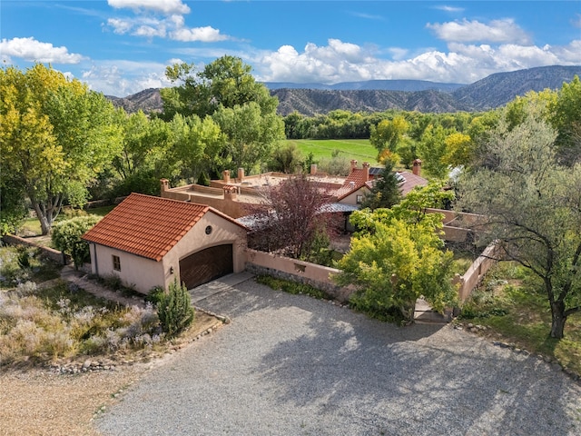 birds eye view of property featuring a mountain view