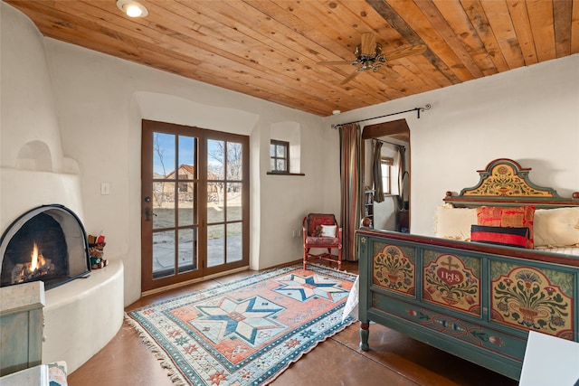 bedroom with a fireplace and wooden ceiling