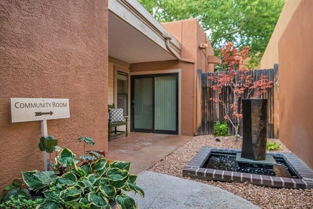 entrance to property featuring a patio