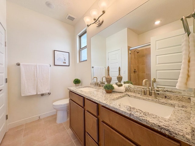 3497 Aster Ln, Santa Fe, NM 87507 - bathroom featuring a sink, visible vents, tile patterned floors, and tiled shower