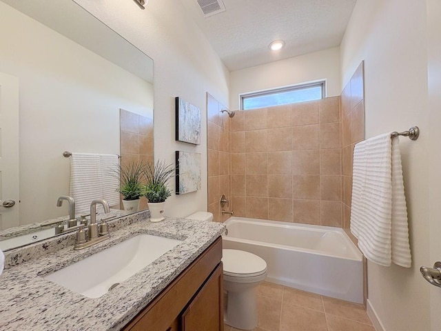 3497 Aster Ln, Santa Fe, NM 87507 - bathroom with tile patterned floors, toilet, bathing tub / shower combination, a textured ceiling, and visible vents