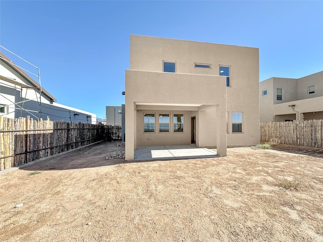 back of house featuring a patio