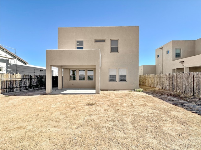 back of house featuring a patio