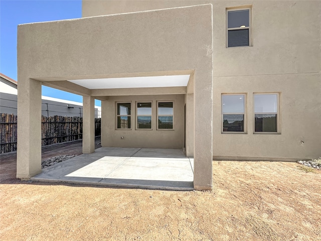 rear view of house featuring a patio