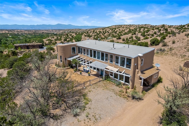 birds eye view of property featuring a mountain view