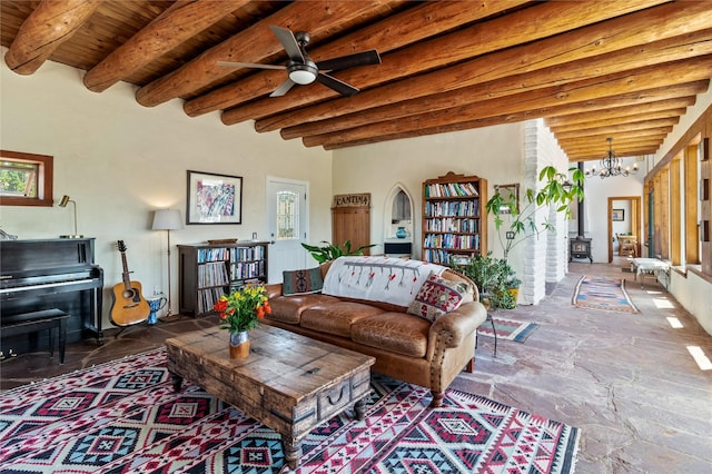 living room with wooden ceiling, beamed ceiling, and ceiling fan with notable chandelier