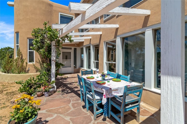 view of patio featuring outdoor dining space