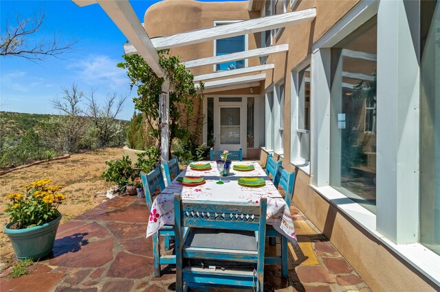 view of patio / terrace featuring a mountain view