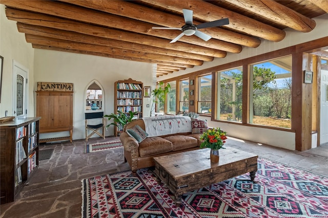 sunroom with wooden ceiling, ceiling fan, and beam ceiling