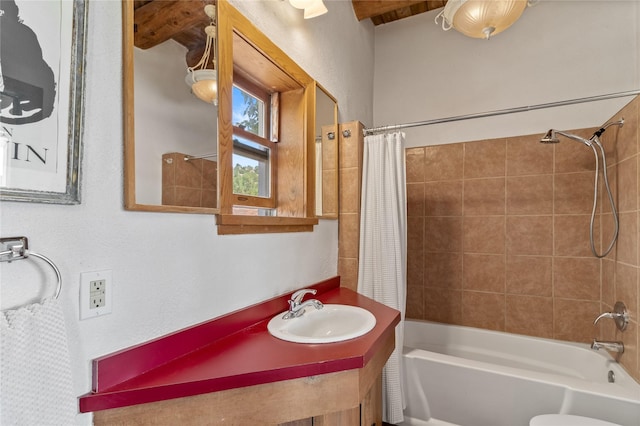 full bathroom featuring a sink and shower / tub combo with curtain