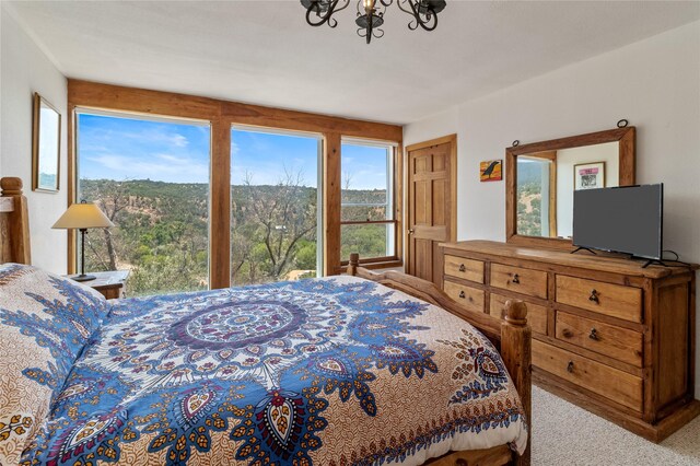 unfurnished sunroom featuring a mountain view, beam ceiling, and wooden ceiling