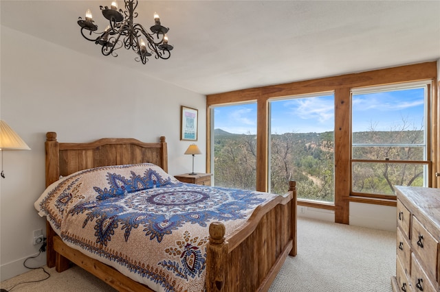 bedroom with multiple windows and light carpet