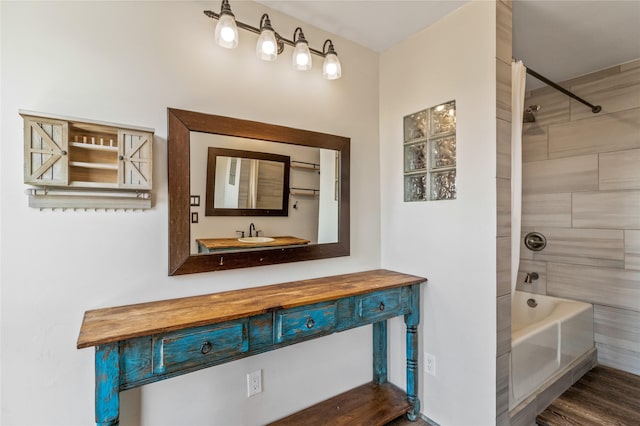 full bath with vanity, shower / tub combination, and wood finished floors