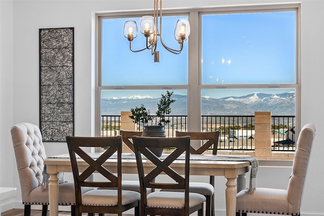 dining space with an inviting chandelier