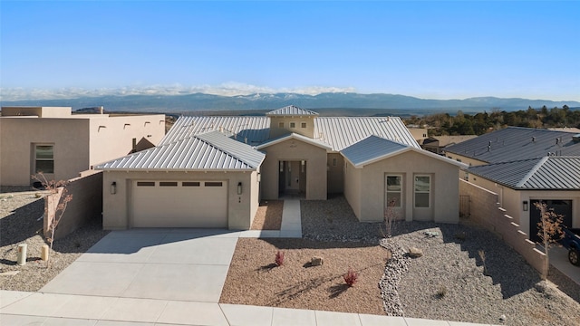 view of front of house with a mountain view and a garage