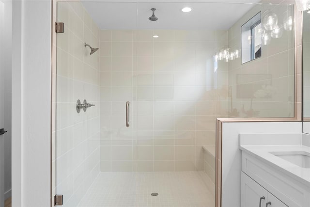 bathroom with vanity and an enclosed shower