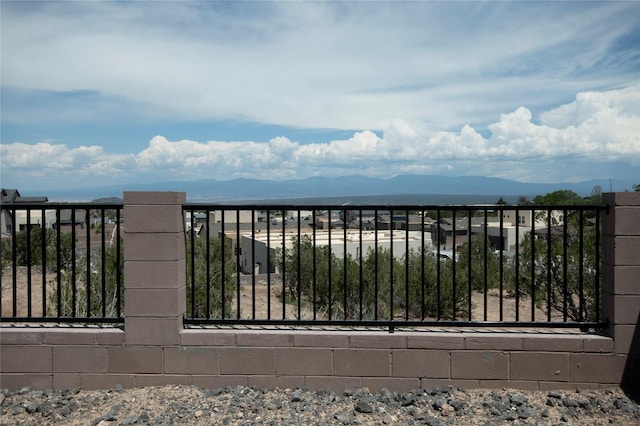 view of gate featuring a mountain view