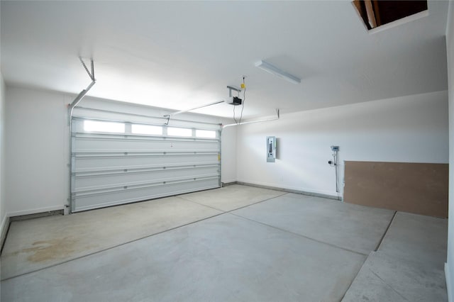 garage featuring a garage door opener and electric panel