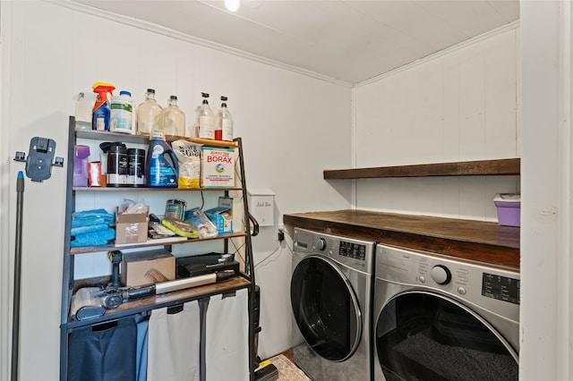 clothes washing area with laundry area, separate washer and dryer, and crown molding