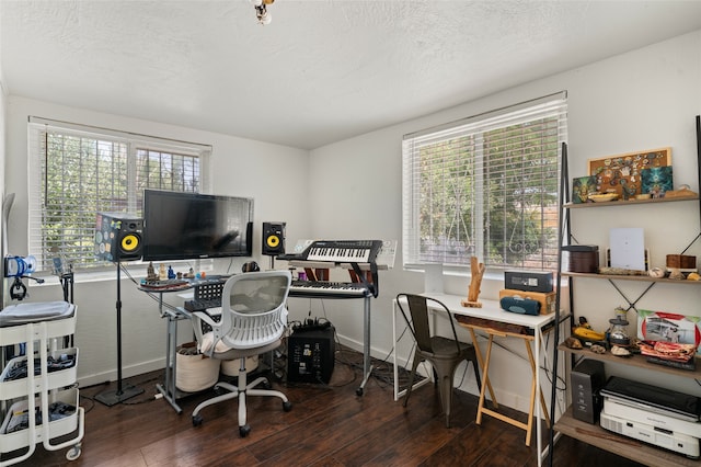 office space with a textured ceiling and dark hardwood / wood-style floors